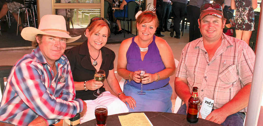 Tim and Kym Minogue, Anne Glass and Wayne Benz relax in the members bar.